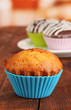 Sweet cupcakes on wooden table