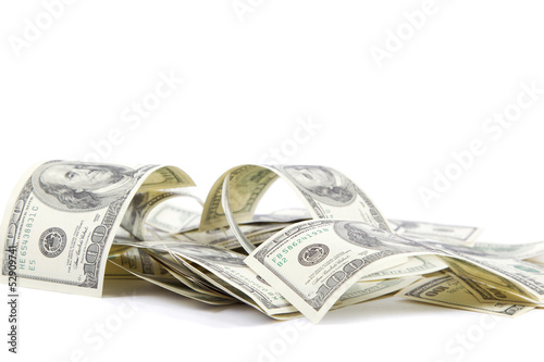 Photo: Heap of one hundred dollar bills U.S. on white background Heap of one hundred dollar bills U.S. on white background
