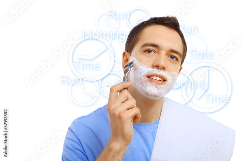 Photo: Young man shaving Young man shaving