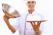 Cook holding an empty tray