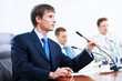 Photo: Three businesspeople at meeting Three businesspeople at meeting