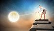 Woman pulling moon
