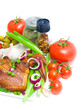 vegetables and smoked chicken wings on a white background