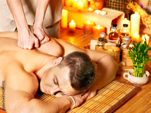Photo: Man getting aroma massage in spa. Man getting aroma massage in spa.