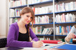 Portrait of a student in a library