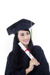 Beautiful woman in black graduation gown - isolated