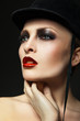 Fashion horsewoman wearing black hat
