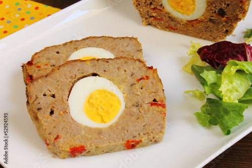 Photo: Sliced meatloaf with boiled egg, red pepper and capers Sliced meatloaf with boiled egg, red pepper and capers