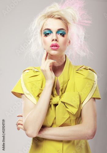 Photo: Vivid Blond Hair Woman with Conspicuous Makeup. Glamor Vivid Blond Hair Woman with Conspicuous Makeup. Glamor