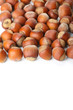 Unbroken hazelnuts on white surface