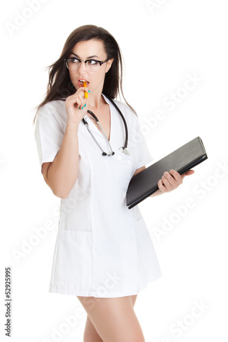 Photo: Smiling medical doctor woman Isolated over white background. Se Smiling medical doctor woman Isolated over white background. Se
