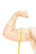 Studio shot of a male muscles with measuring tape