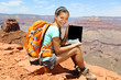 Tablet computer woman hiker hiking in Grand Canyon