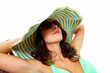 Woman wearing sunglasses and a hat.