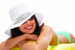 Woman wearing sunglasses and a hat.