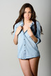 Young casual woman style over gray background. Studio portrait