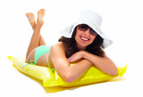 Woman wearing sunglasses and a hat.