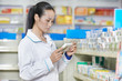 Photo: Chinese pharmacy chemist woman in china drugstore Chinese pharmacy chemist woman in china drugstore