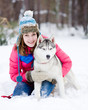 Portrait of a pretty young woman with her pet dog
