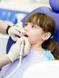 little girl  with open mouth during drilling treatment at the de