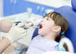 Foto: dentist holding a syringe and anesthetizing his patient dentist holding a syringe and anesthetizing his patient