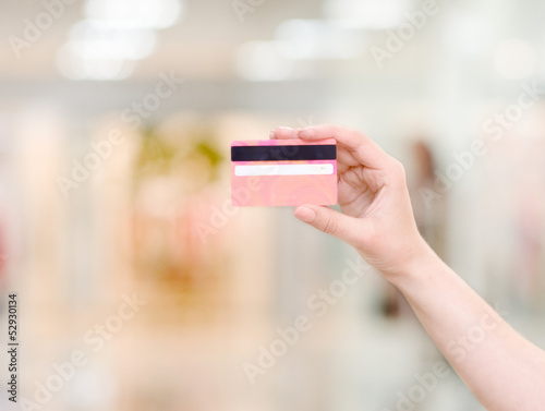 Photo: Female hand holding credit card Female hand holding credit card