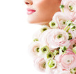 fashion model with  pink flowers in her hair.