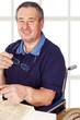 Man sitting in a wheelchair at the table