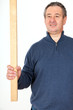 Man with wooden slat