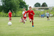 boys  kicking football
