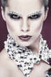 Photo: beautiful girl with strasses on face, on a violet beautiful girl with strasses on face, on a violet