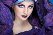 beautiful  girl in a head-dress from the coloured fabric