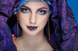 beautiful  girl in a head-dress from the coloured fabric