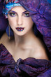 beautiful  girl in a head-dress from the coloured fabric