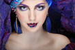 beautiful  girl in a head-dress from the coloured fabric