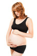 Pregnant woman holding her tummy isolated on white