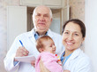   pediatrician doctors with baby