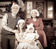 antique photo of happy family in Santa hat