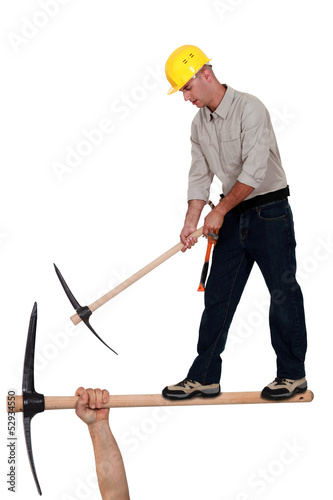 Photo: Worker with pick ax Worker with pick ax