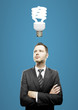 businessman and energy-saving lamp