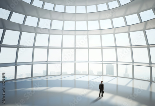 Photo: man standing in big hall man standing in big hall