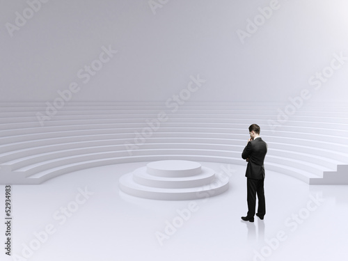 Photo: man lookig on podium man lookig on podium