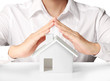 Photo: holding house representing home ownership holding house representing home ownership