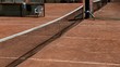 tennis ball into the net