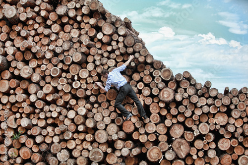 Photo: businessman escaping from top position businessman escaping from top position