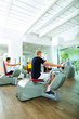 Foto: People in sport gym on machines People in sport gym on machines