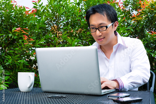 Photo: Chinese Businessman working outdoor Chinese Businessman working outdoor