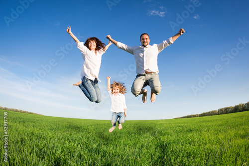 Photo: Happy family jumping Happy family jumping