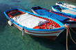 Wooden fishing boats on crystalline water