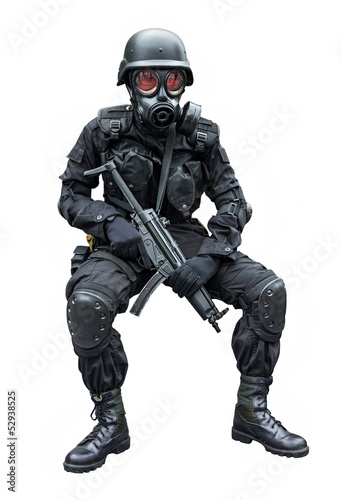 Photo: Special force soldier sitting in isolation background . Special force soldier sitting in isolation background .